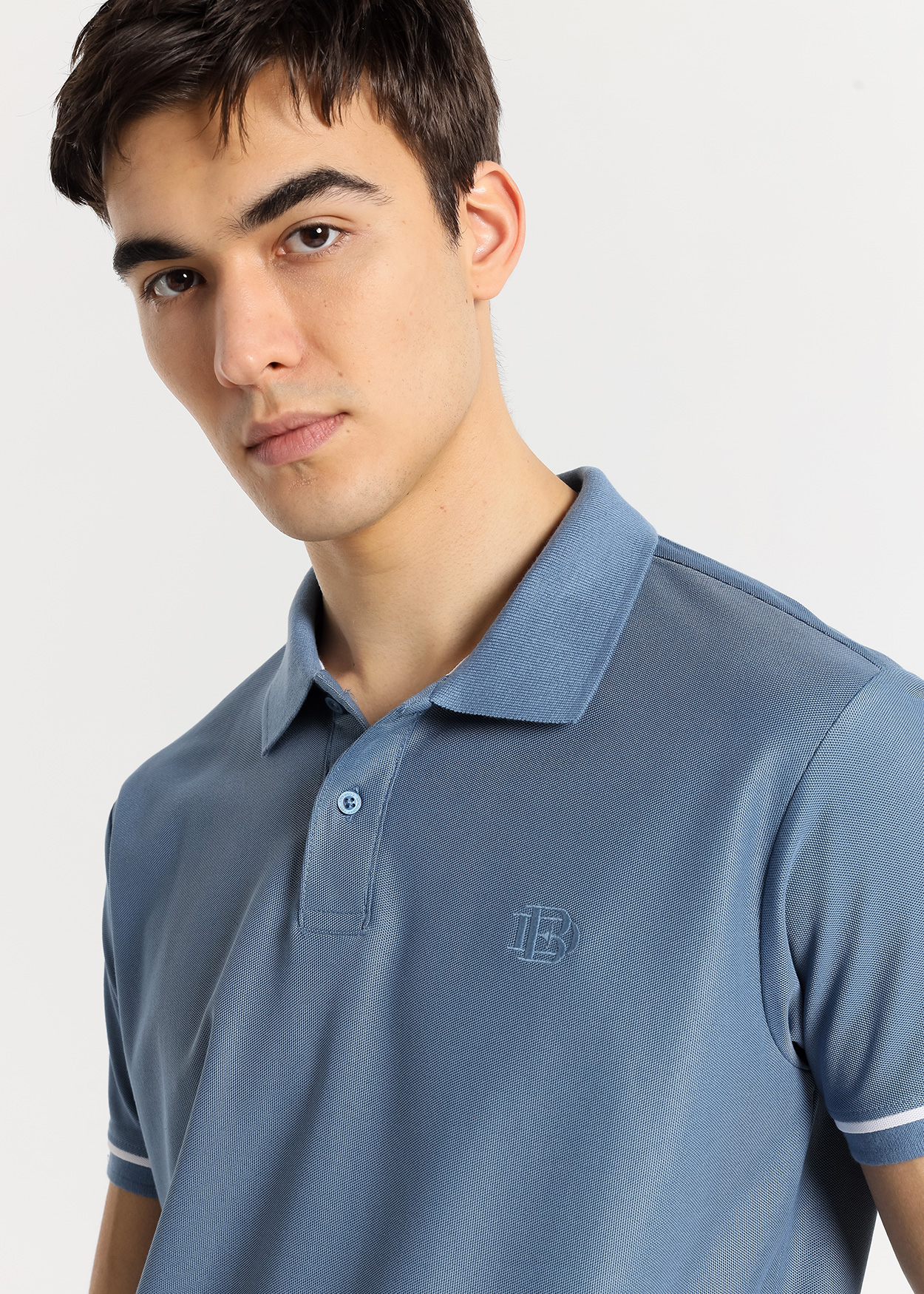 Pólo manga curta com detalhe na manga Azul